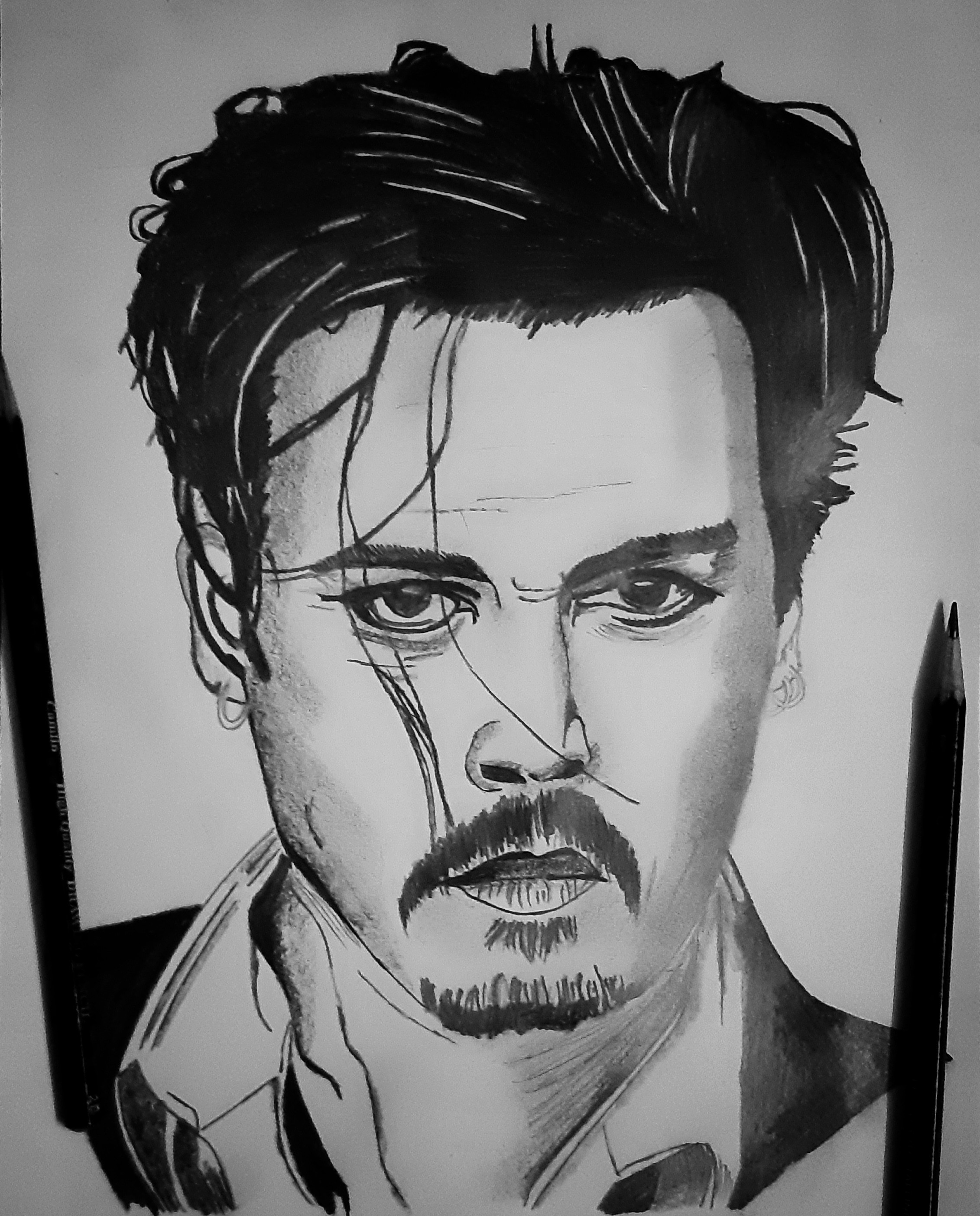 A pencil portrait sketch of a man.