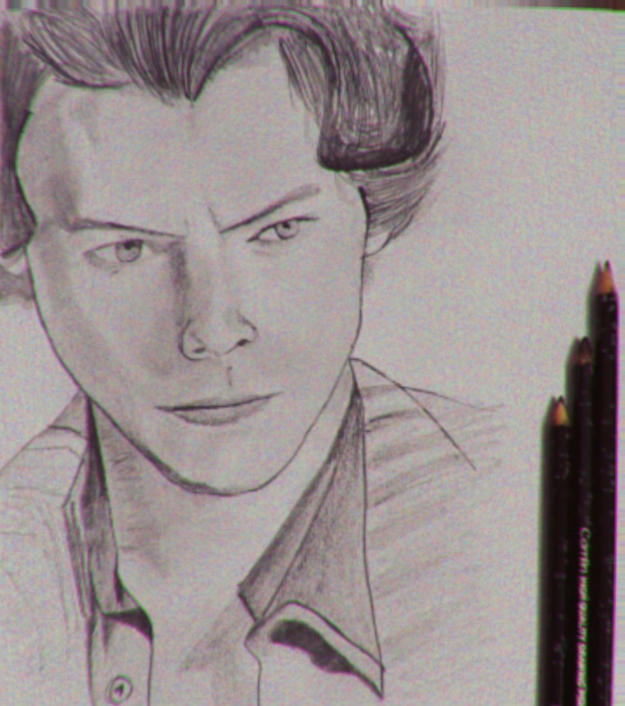 A pencil portrait sketch of a man.